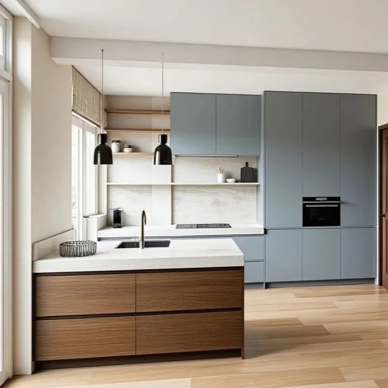 Modern kitchen with light blue cabinets, white countertops, and a wooden kitchen island. There are two black pendant lights hanging over the island, and open wooden shelves with small decorative items and cups above the sink. Large window on the left lets in natural light.
