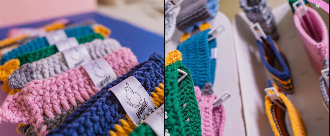 Colorful handmade crocheted baby headbands with a label featuring a rabbit logo and the word "LOVABLE".