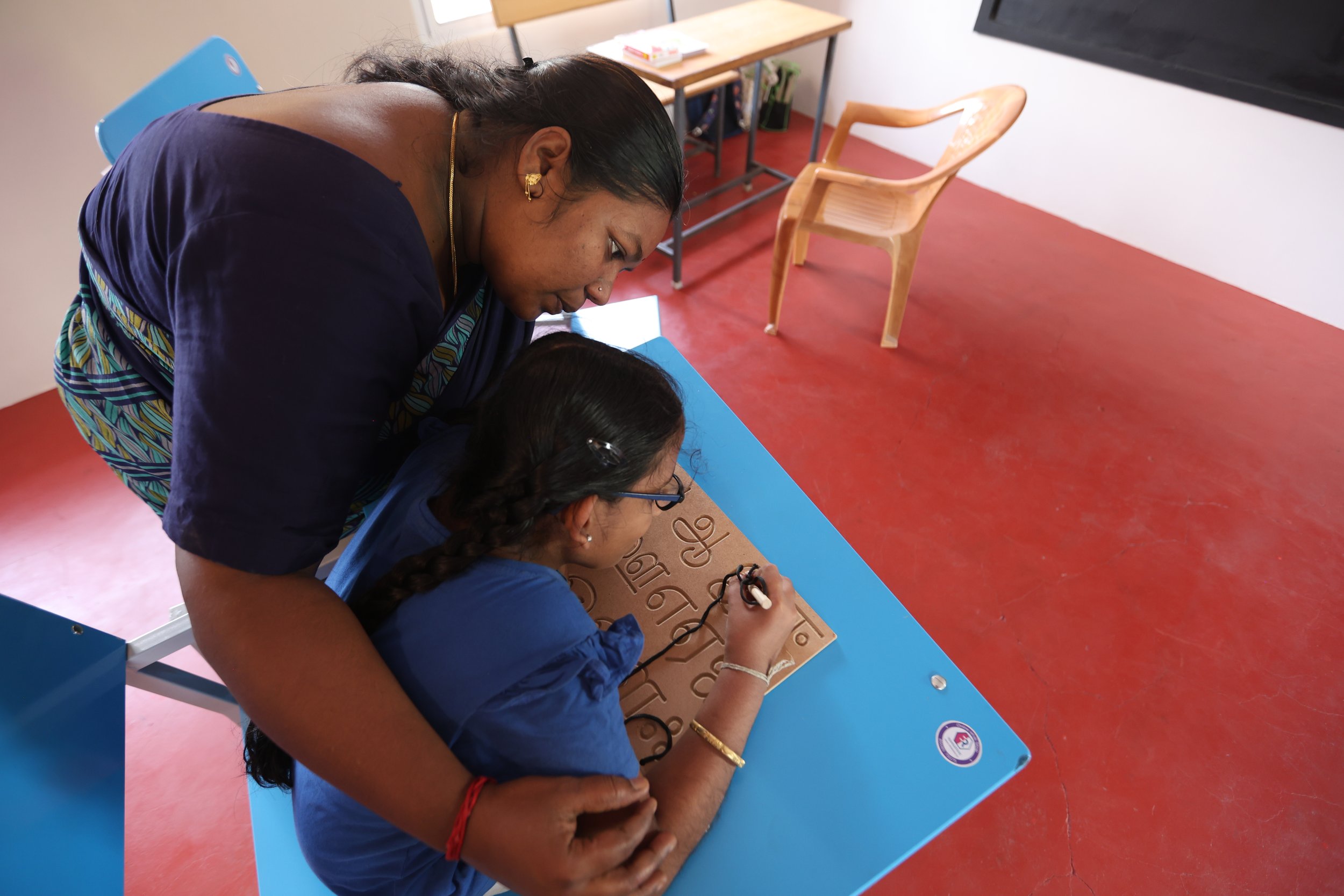 Special education teacher working with a child