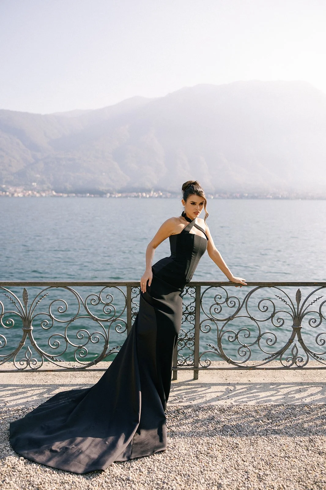 Guest dressed in black tie  overlooking Lake Como from Villa balbiano .