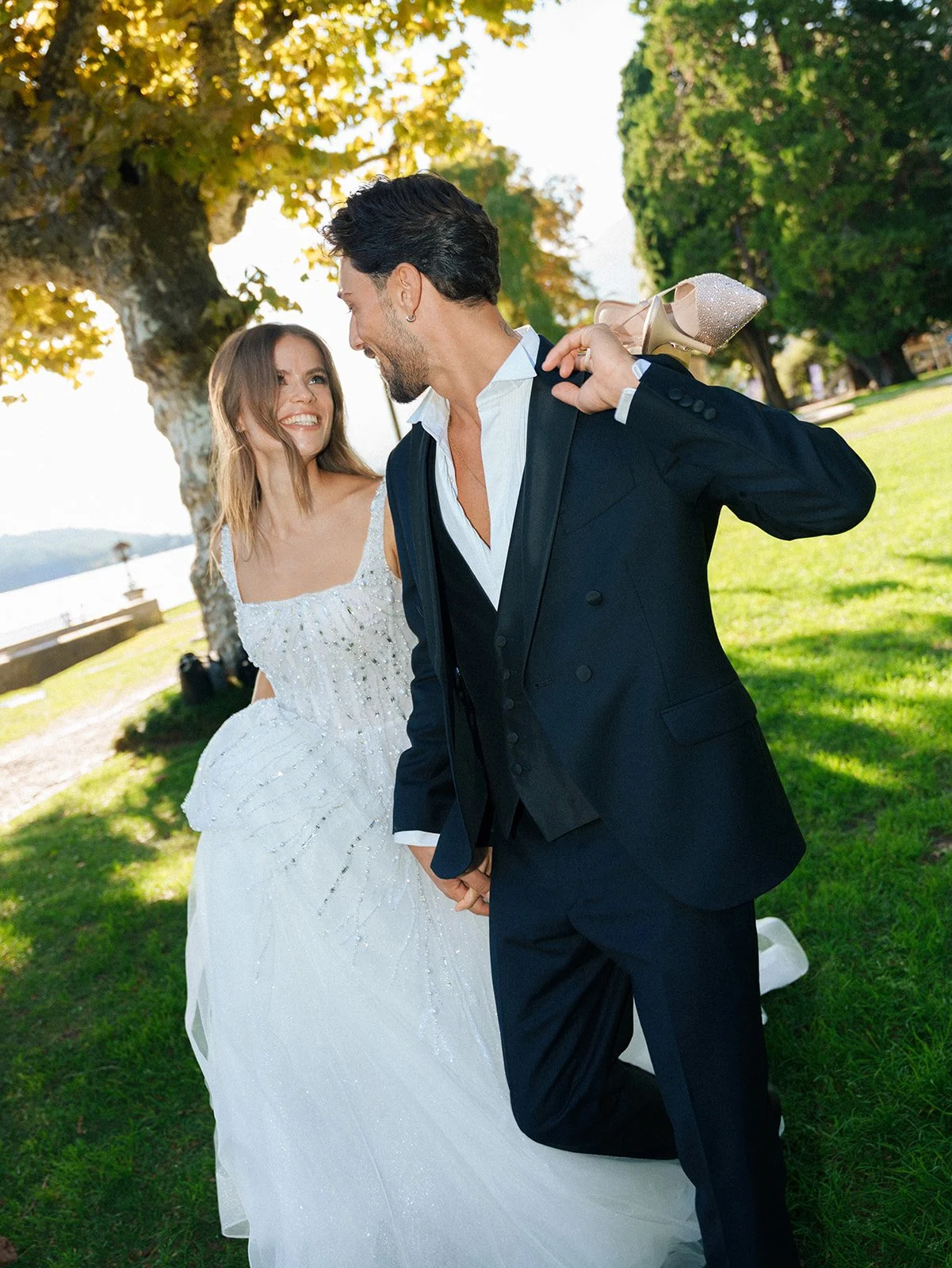 Couple walking through a historic lakeside garden during an intimate Lake Como elopement.