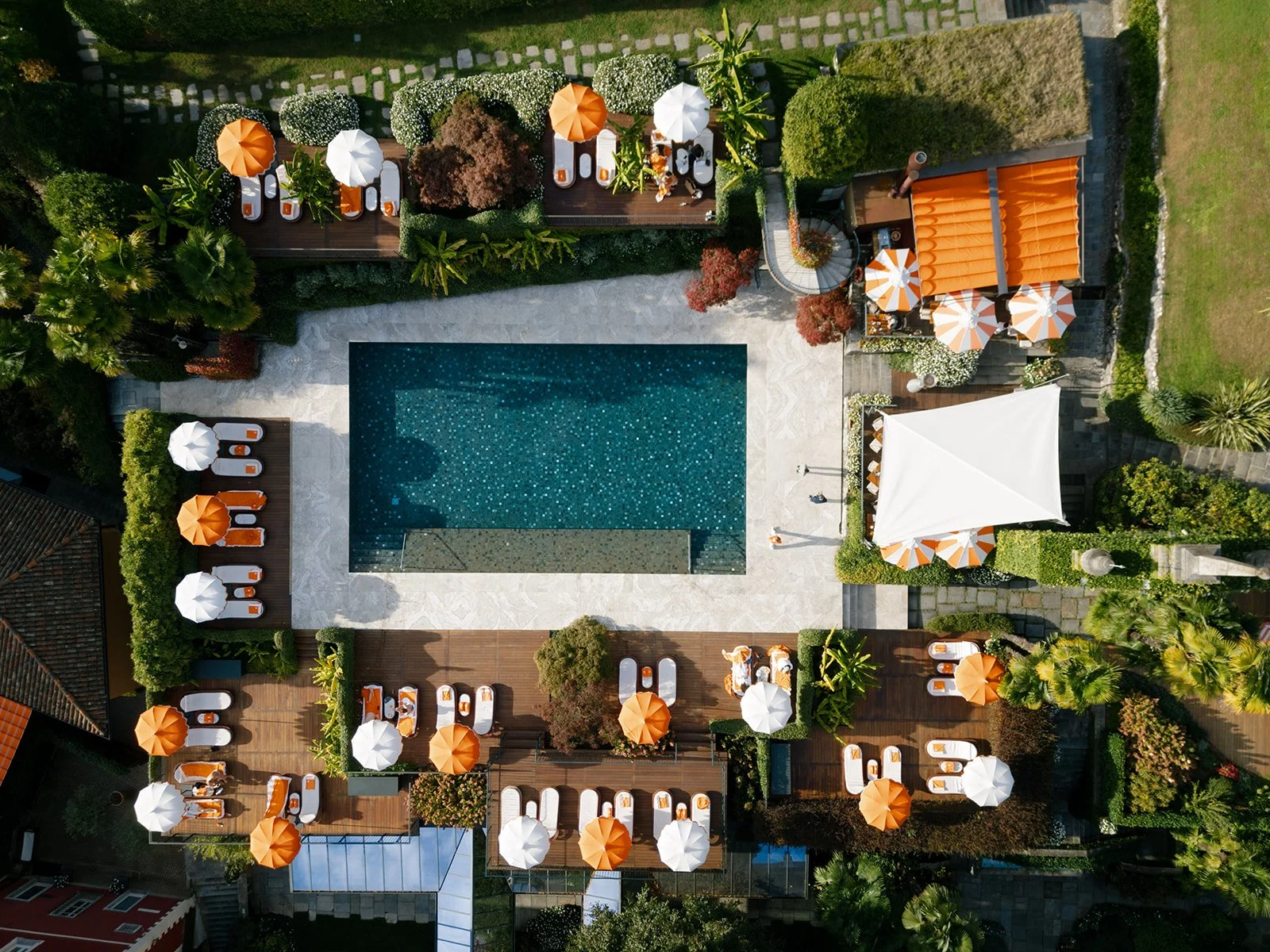 Aerial view of the pool, gardens and outdoor hospitality spaces at Grand Hotel Tremezzo on Lake Como.