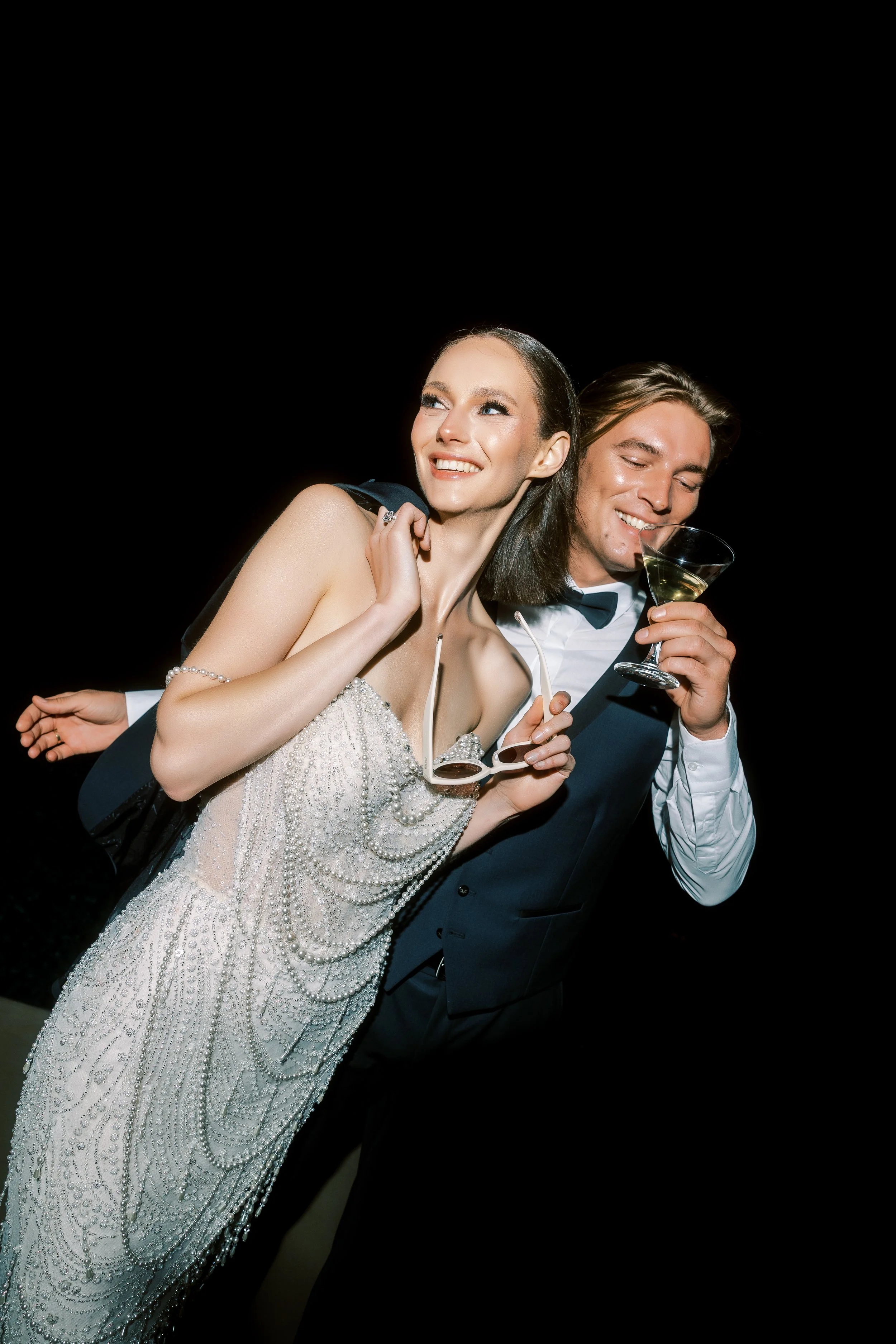 Bride and groom celebrating together during an evening destination wedding in Crete.