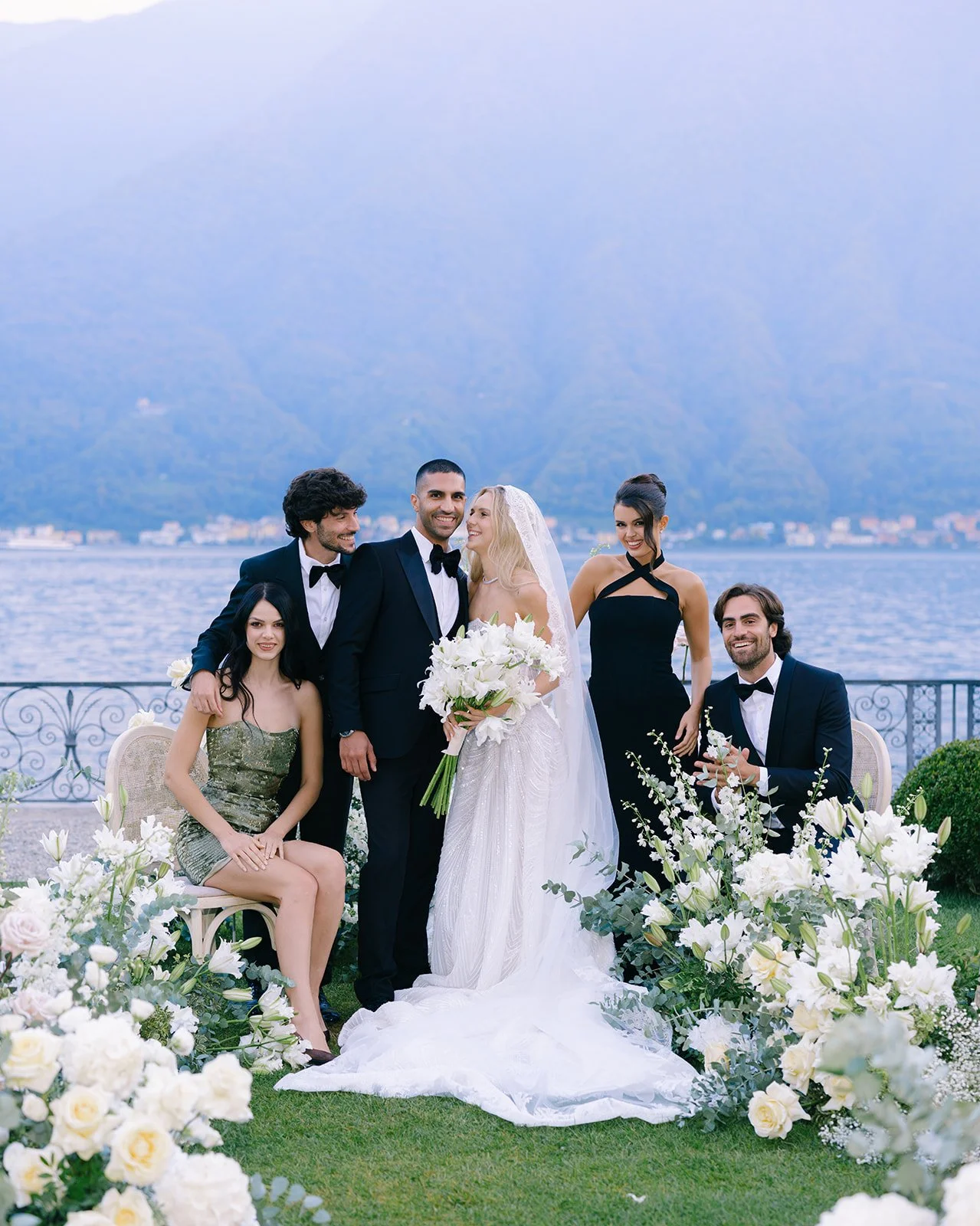 Bride, groom and wedding party beside the lakeside ceremony at Villa Balbiano, Lake Como.