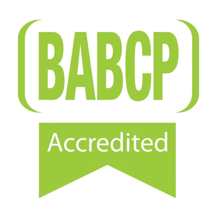 BABCAP Accredited logo in green with stylized parentheses around the acronym and a green ribbon underneath with the word 'Accredited' in white text.