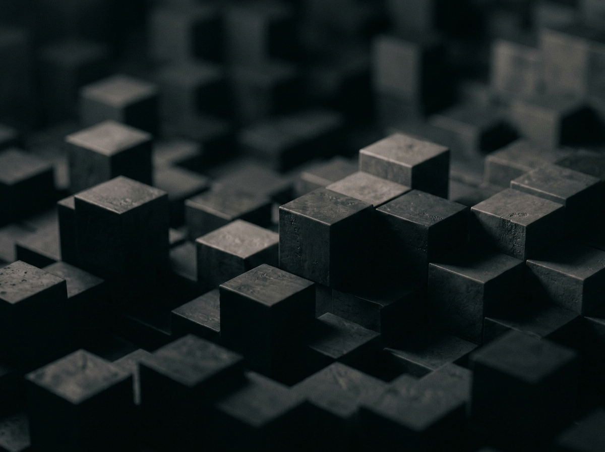 A close-up of black and dark gray 3D cubes arranged in a pattern, creating a textured surface with varying heights.