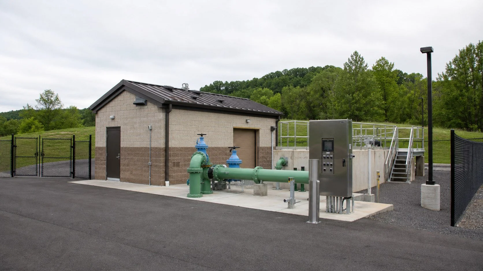 Illustrative view of a municipal pump station and utility infrastructure.