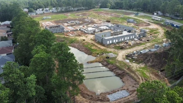 Aerial view of civil-site construction and stormwater facilities documented during field review.