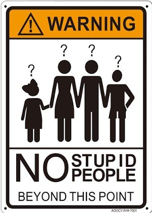 Warning sign with silhouettes of four residents holding hands, each with a question mark above their head, and the text 'No Stupid People Beyond This Point'.