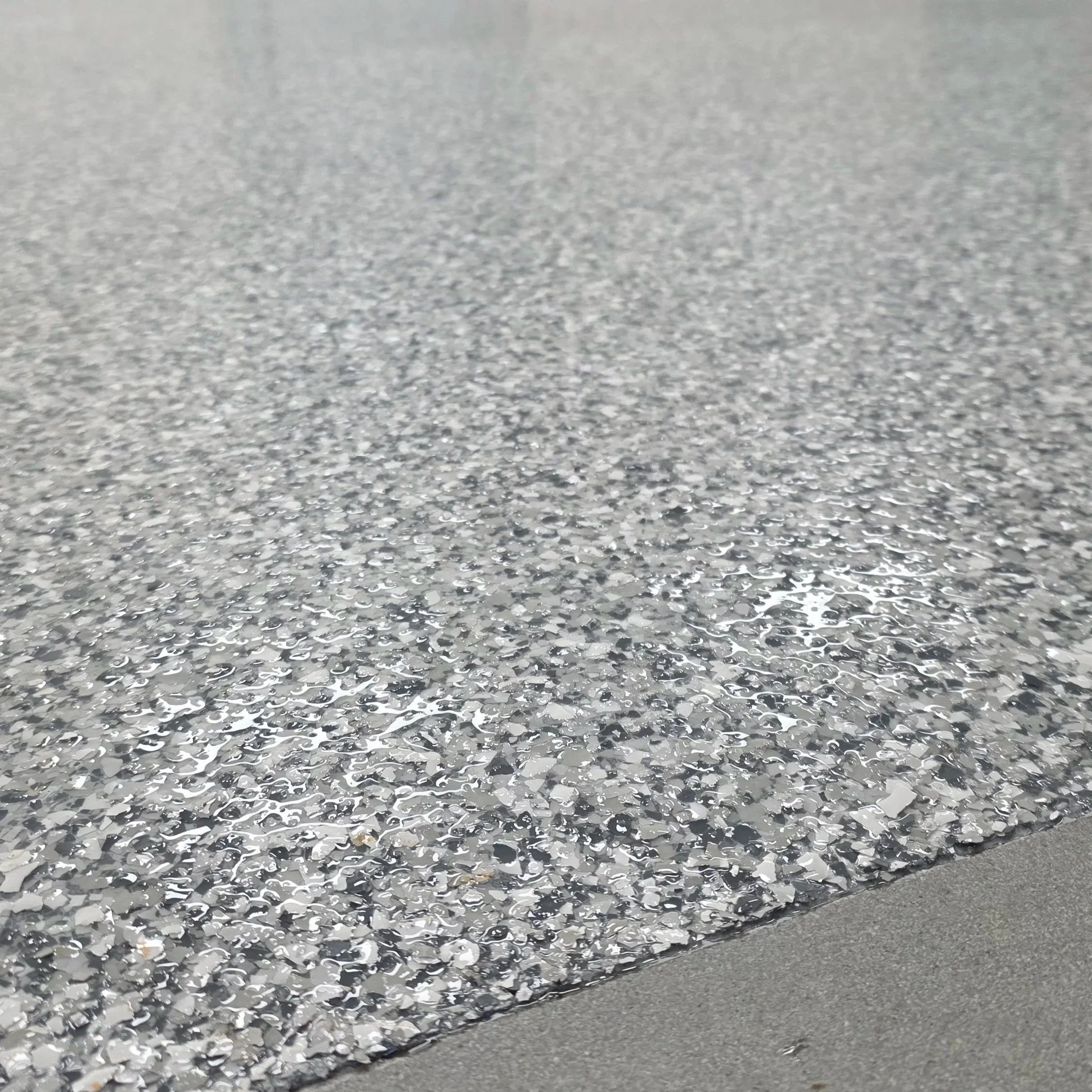 Close-up of a textured, sparkly metallic surface with a rough, granulated pattern.