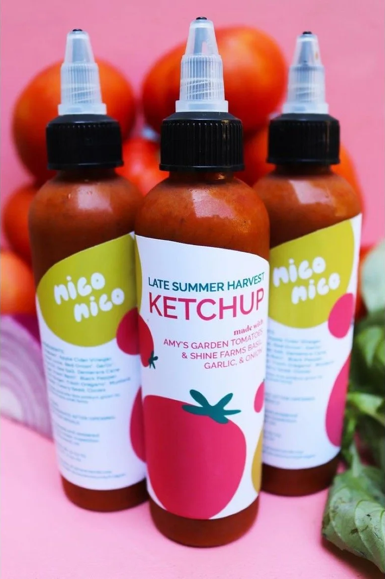 A picture of three ketchup bottles made by the community with donations from the fridges