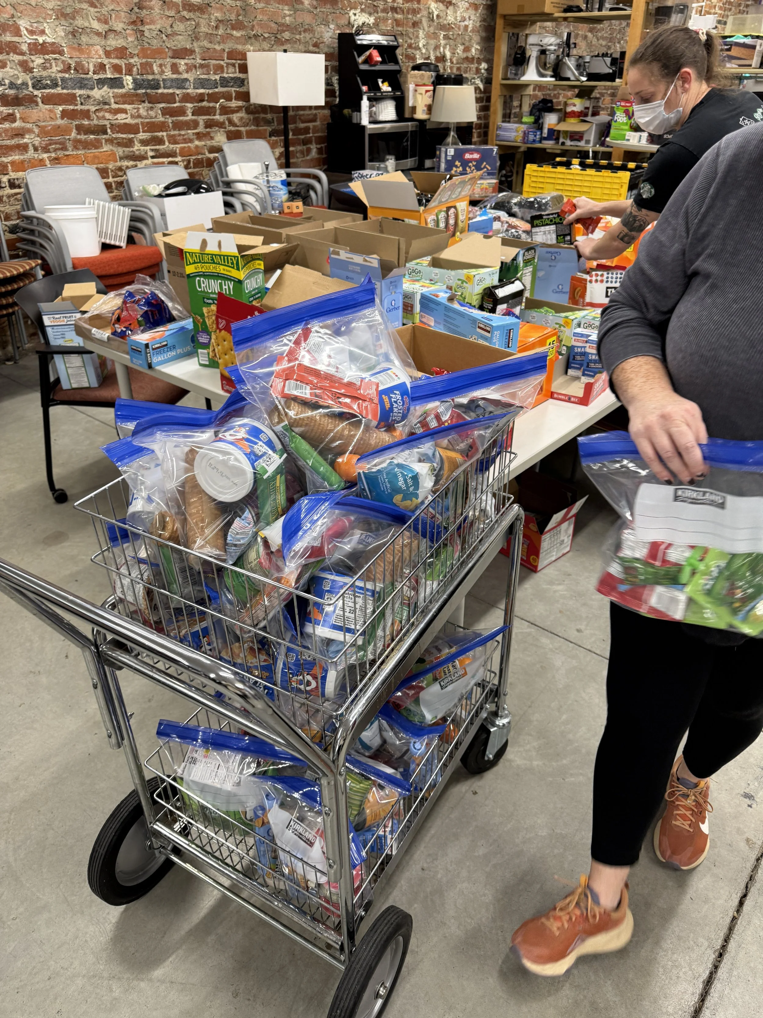A shopping cart full of fresh new donations for 