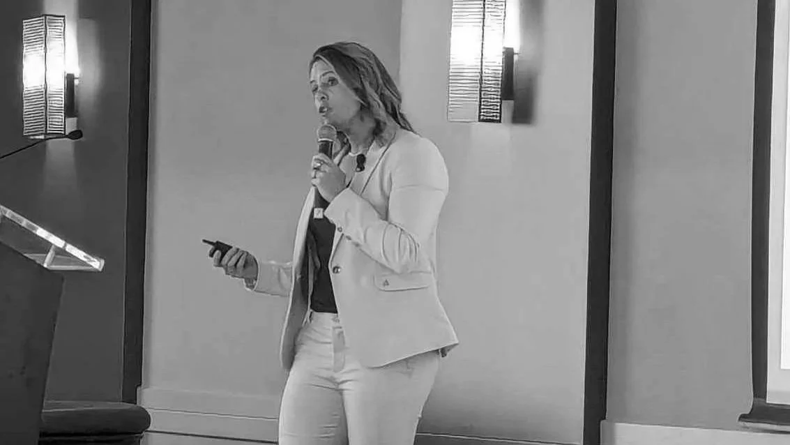 Photo of Jordan publicly speaking at event