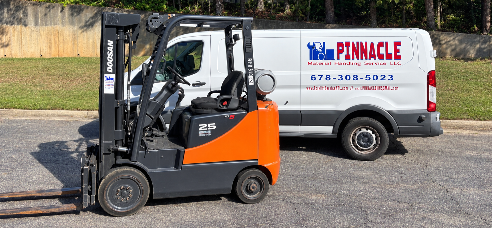 Pinnacle Material Handling Service van with Doosan forklift refurbished in shop by expert technicians.