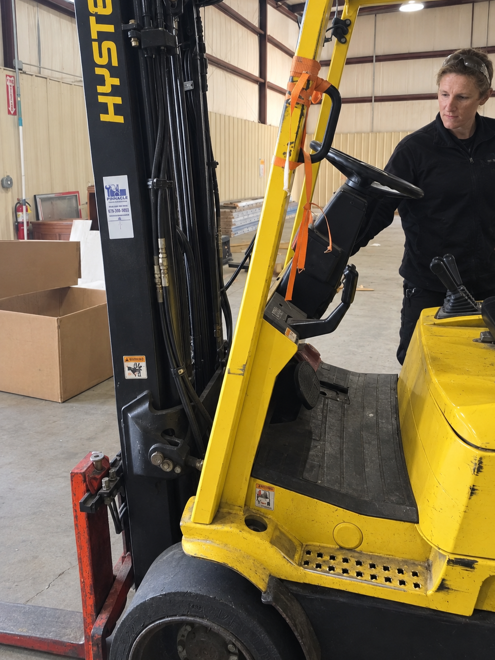 Electrical forklift technician repairing forklift in Marietta, GA.