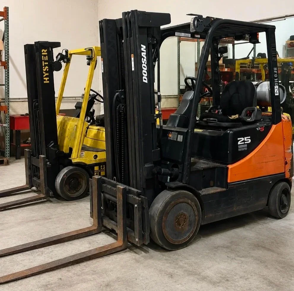 Hyster and Doosan forklift repair in Loganville, GA warehouse.