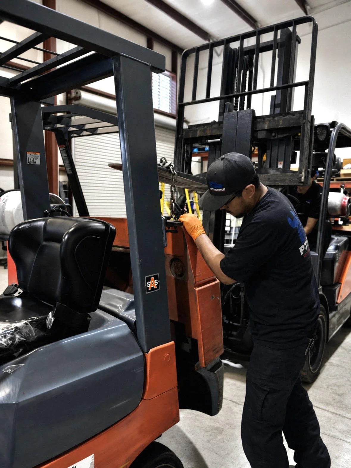 Certified forklift technician servicing Toyota forklift in metro Atlanta.