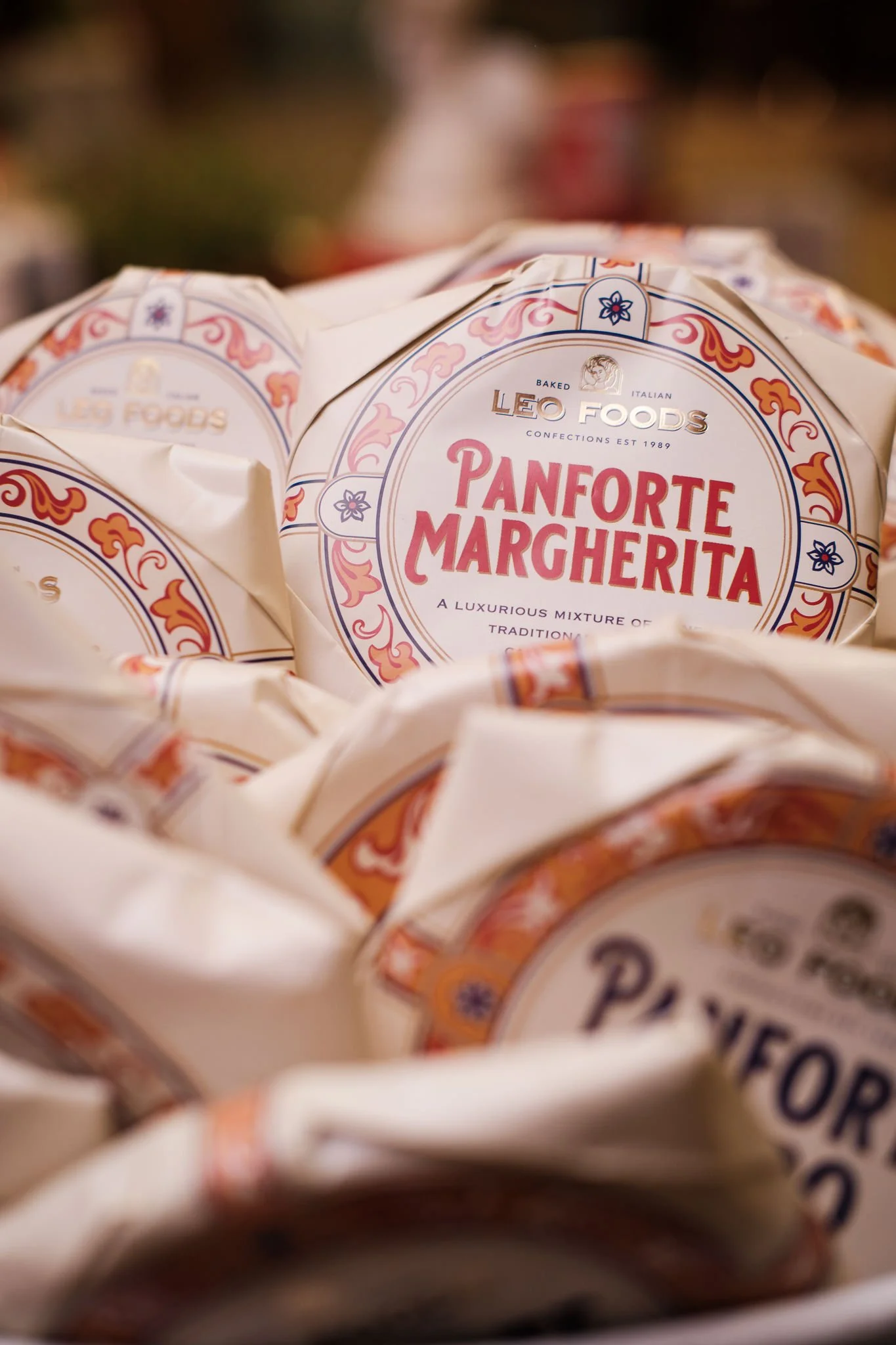 Close-up view of wrapped packages of Lea Foods Panforte Margherita, a traditional Italian confection.