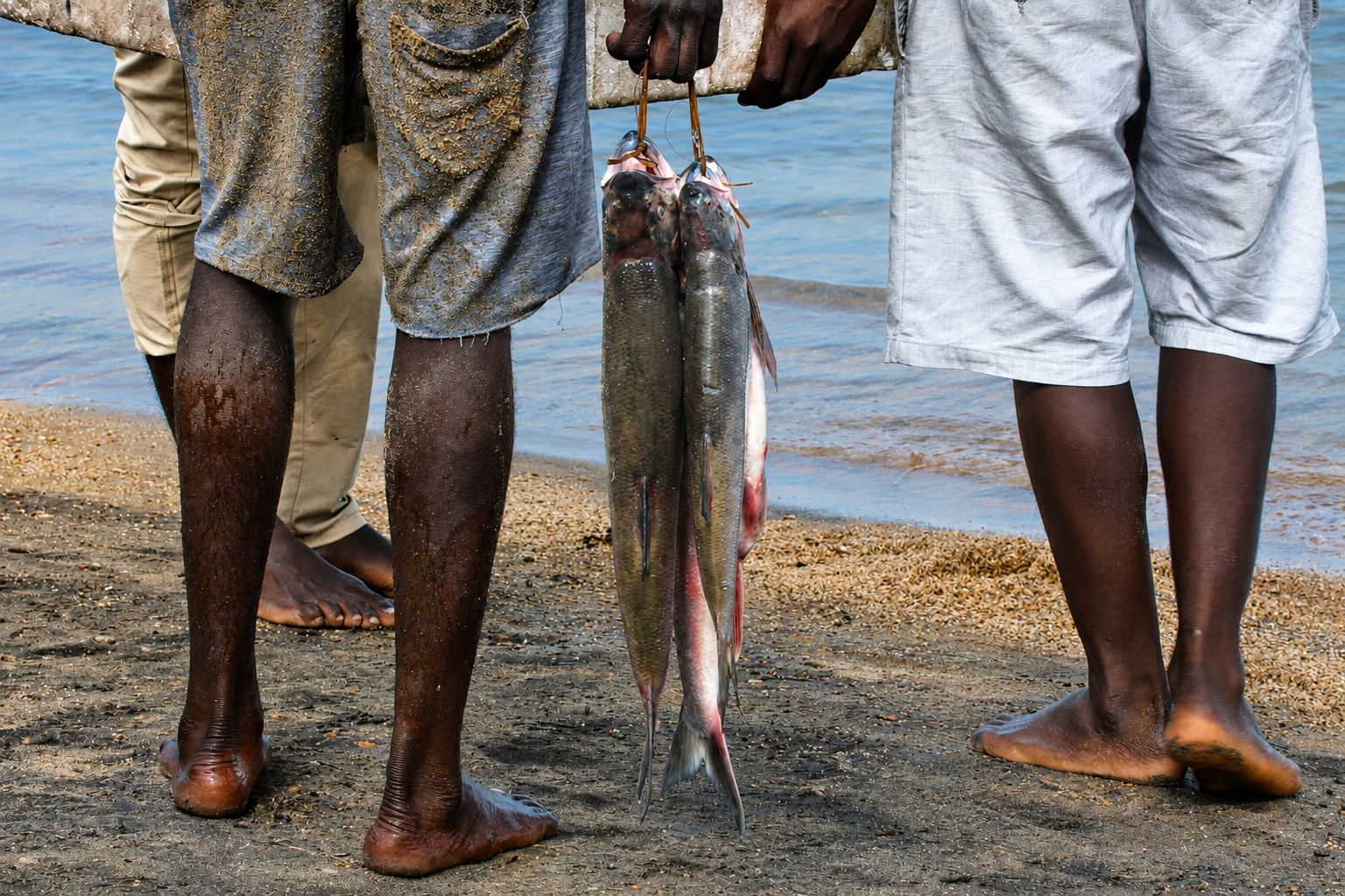 "My father loved fish. Understandably so, since he grew up eating fresh fish. This is one of the first pictures on my first visit to Lake Malawi." © Angela Jimu