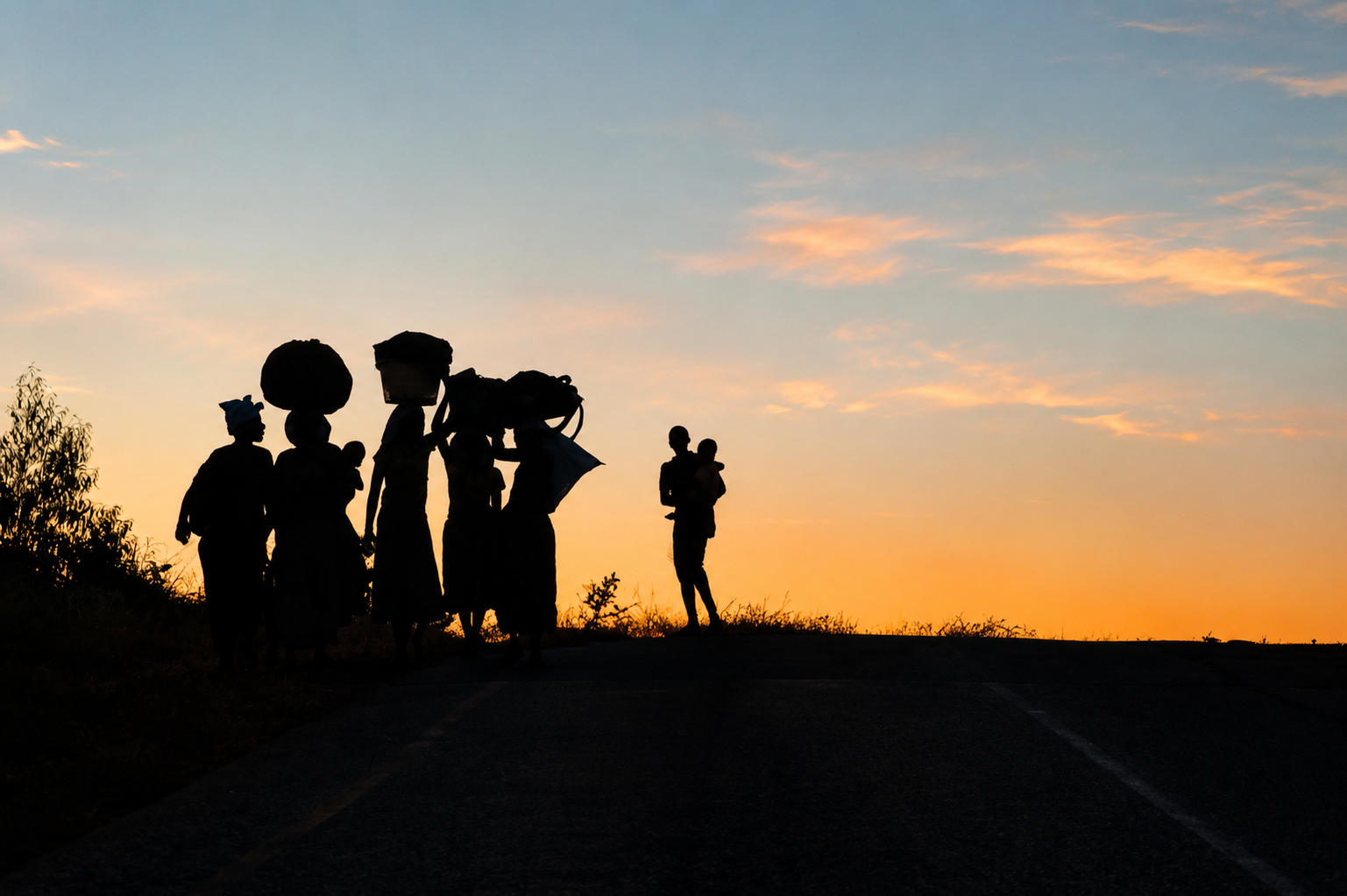 "My father was from Chikwawa District, Southern Region, Malawi. In 2022, I visited Chikwawa for the first time for a church event. Whilst we were driving back to the city, I saw women carrying baskets on their heads and decided to take the picture. T