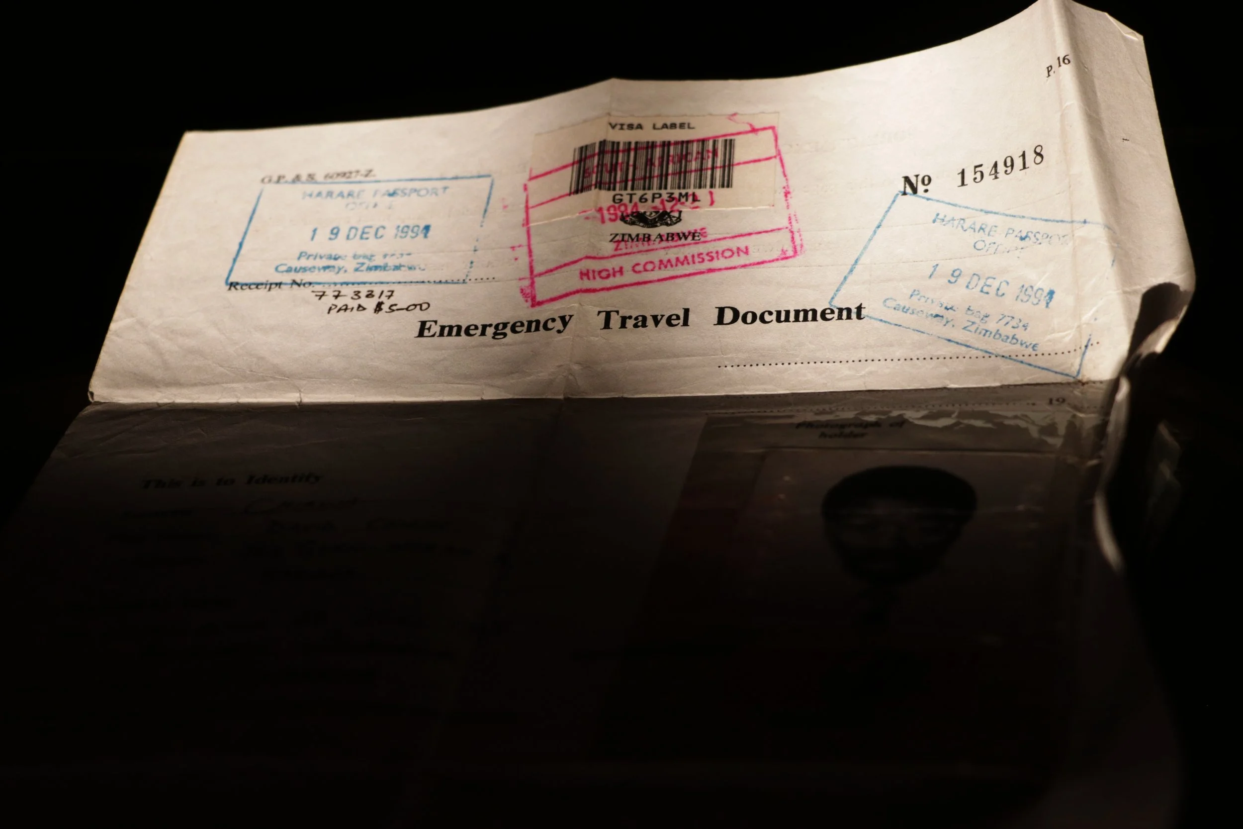 "My father regularly went back home to visit the family there." An old travel document belonging to Martha's father.© Angela Jimu