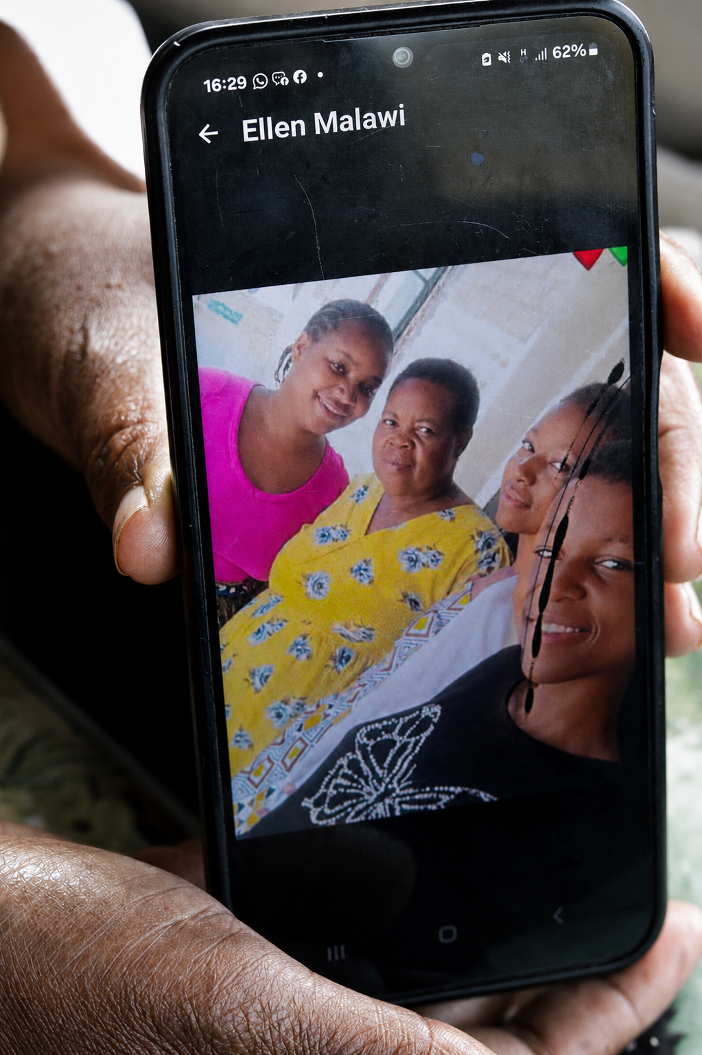 Constance shows a profile picture of her aunt, her mother's sister whom she stays in contact with. © Angela Jimu
