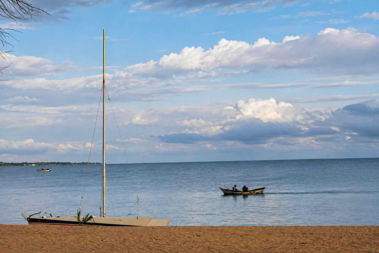 A boat is seen on Lake Malawi, Mangochi. "My father's family relocated to Mangochi and built a new homestead there." © Angela Jimu