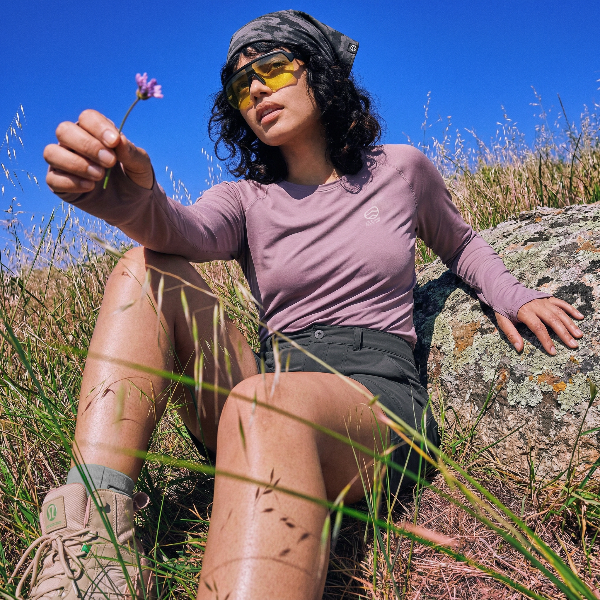 freepik_recreate-img1-but-she-is-wearing-img2-img3-img4-as-a-bandana-on-her-head.-replace-the-man-on-the-left-with-a-boulder_0001.png