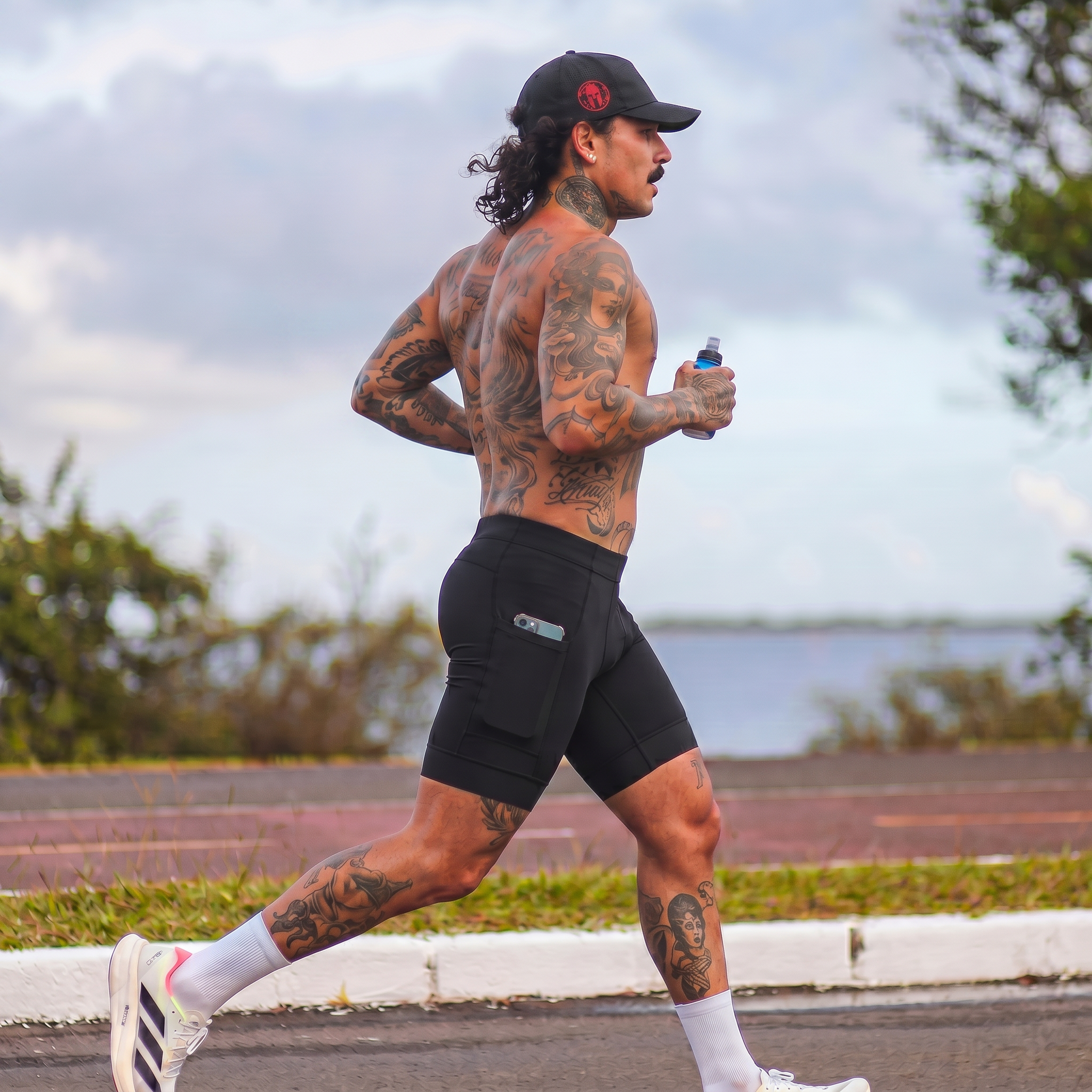 magnific_a-tattooed-man-with-a-mus_3009440357 (1).png