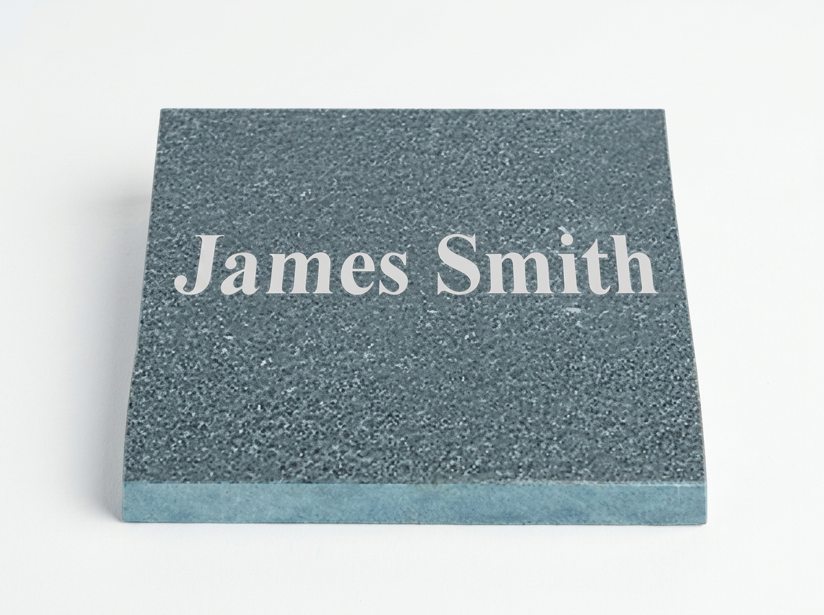 Name tag with the text 'James Smith' on a textured gray background.
