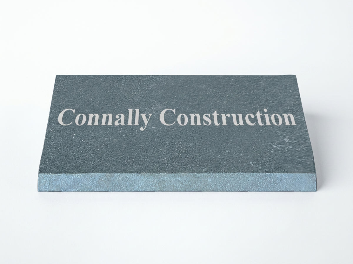 A gray construction brick with the words "Connally Construction" written on it in white.