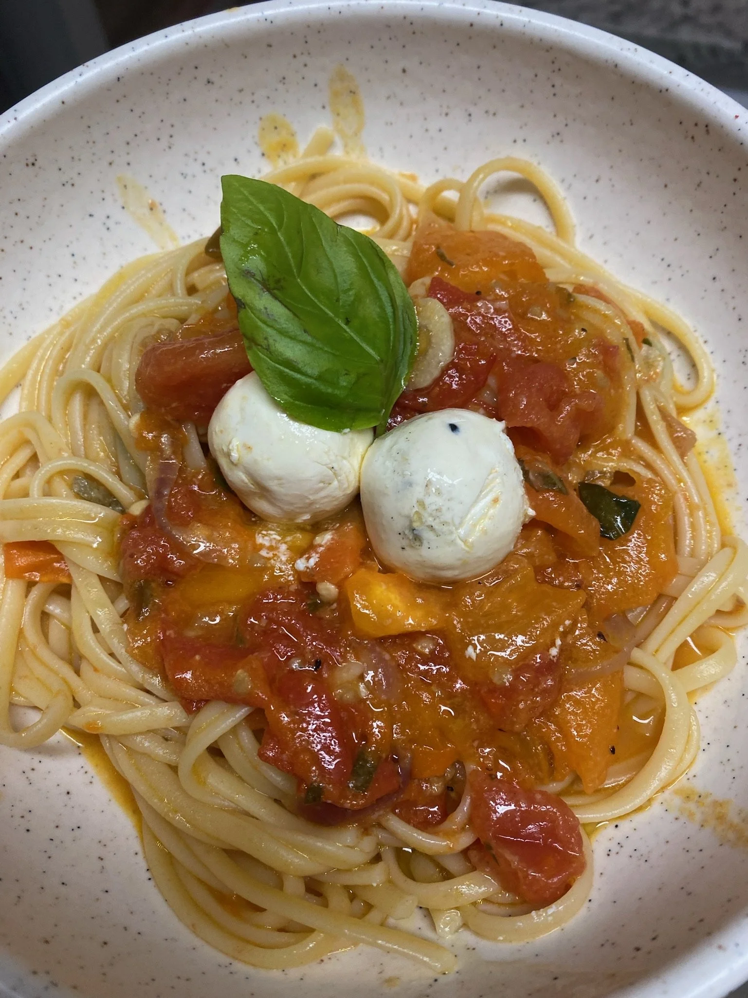 Pasta with tomatoes and basil—a glimpse of everyday cooking.