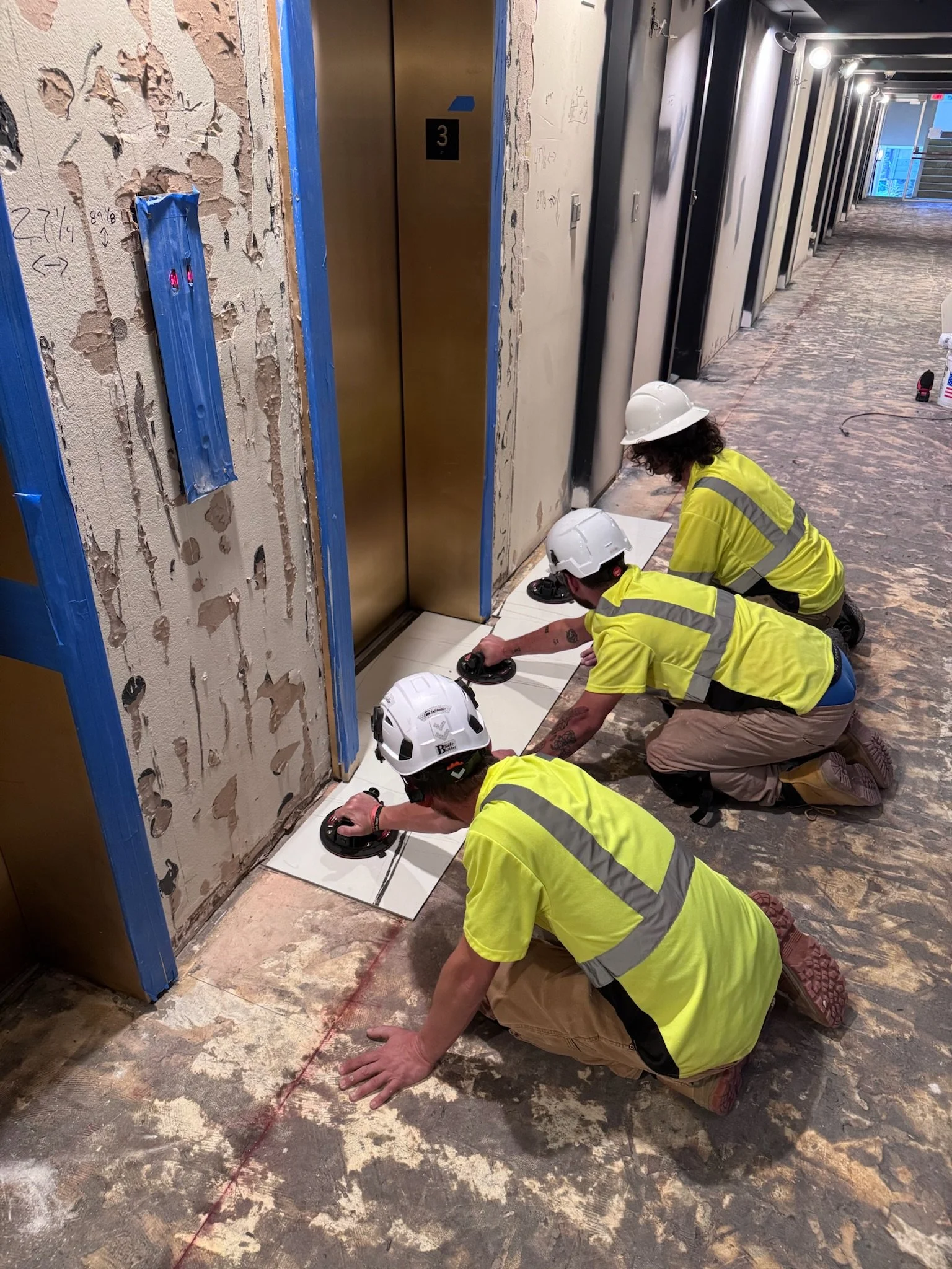 Team install of marble slab