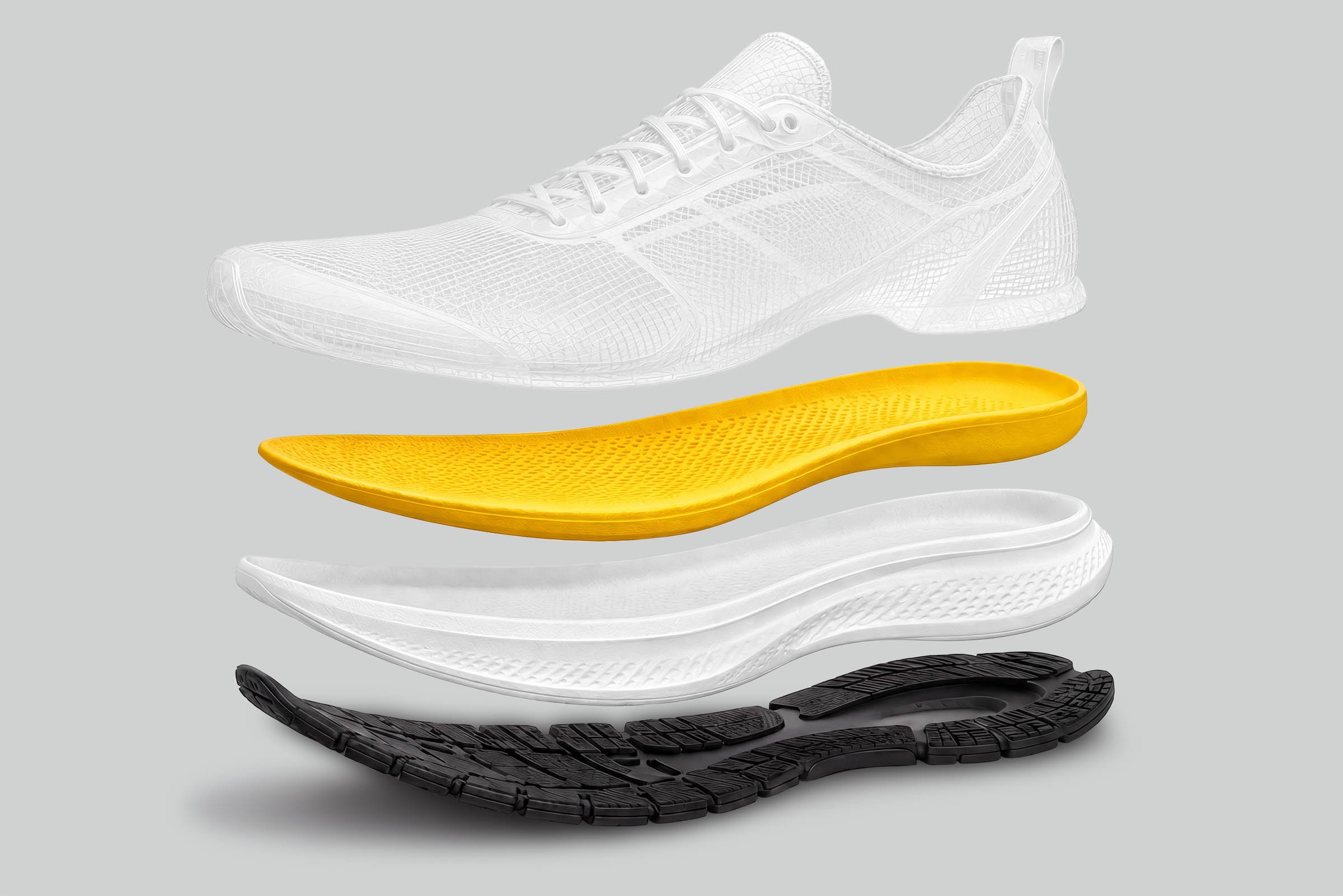 An exploded view of a running shoe with its sole and internal components separated, displaying different layers including the tread, midsole, and inner cushioning.