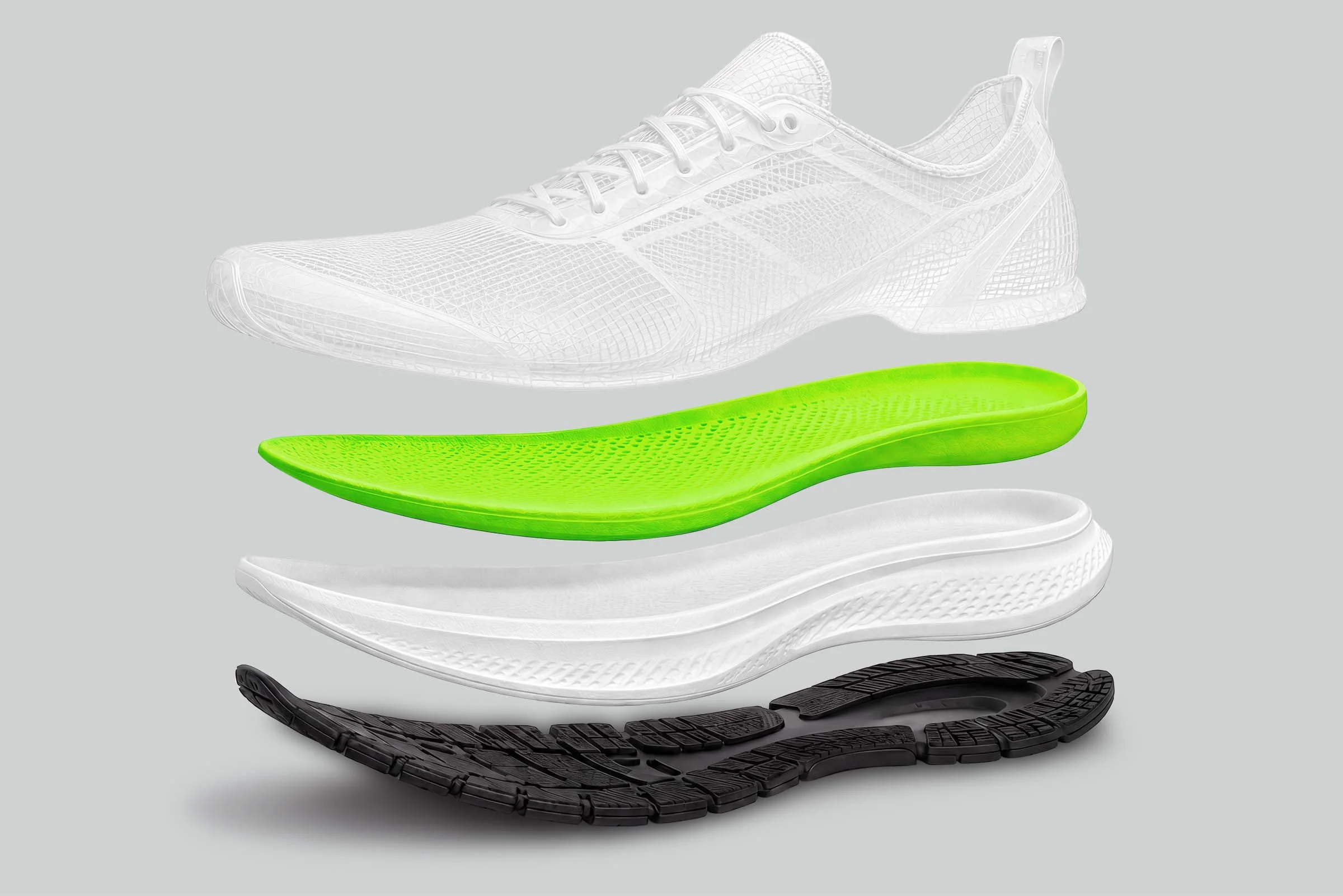 An exploded view of a running shoe with its sole and internal components separated, displaying different layers including the tread, midsole, and inner cushioning.