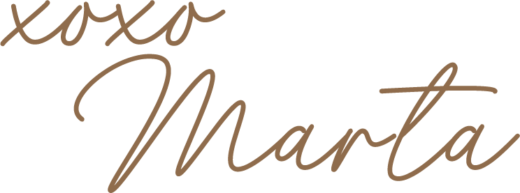 Close-up of a decorative wall with the words "xoxo Marta" written in cursive script.