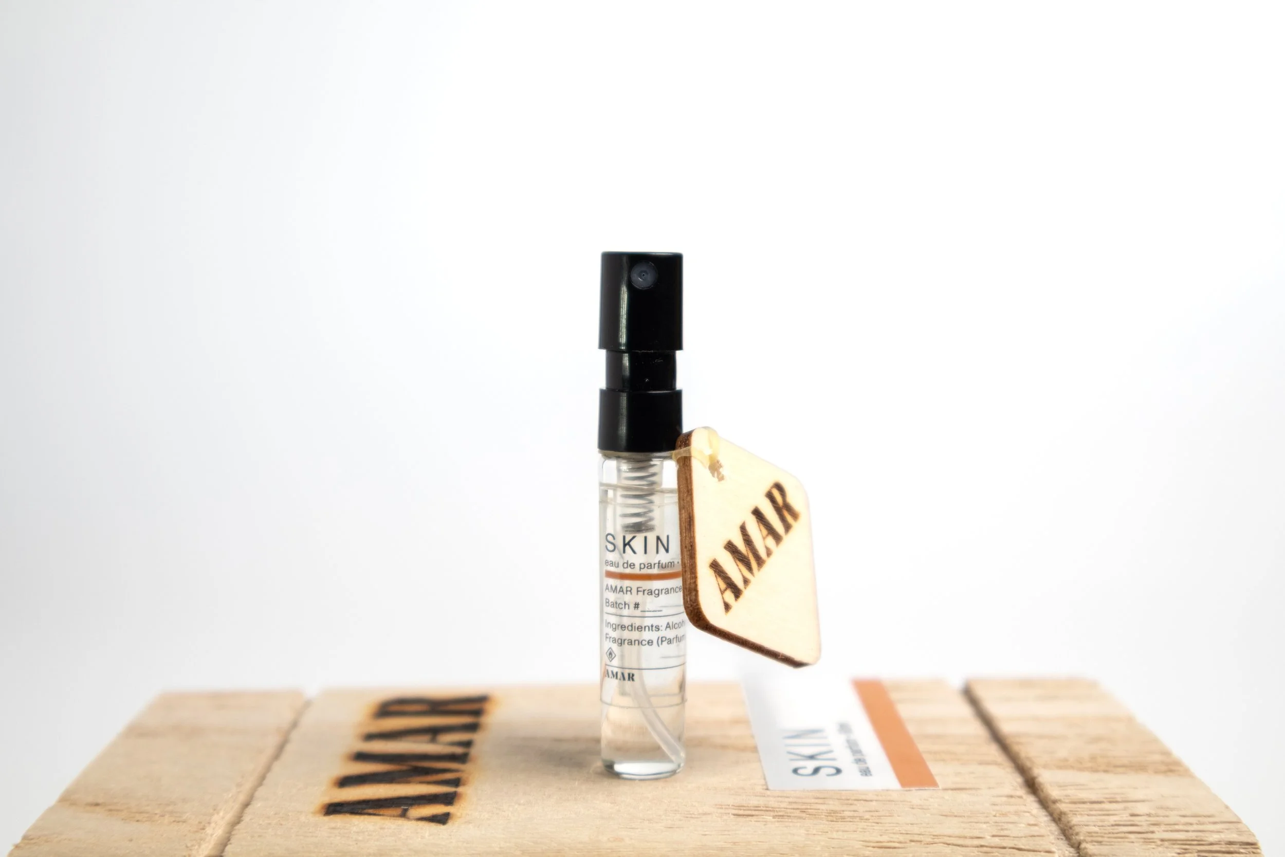 AMAR SKIN 2ml sample bottle with wooden AMAR tag, an 
indie perfume Eau de Parfum