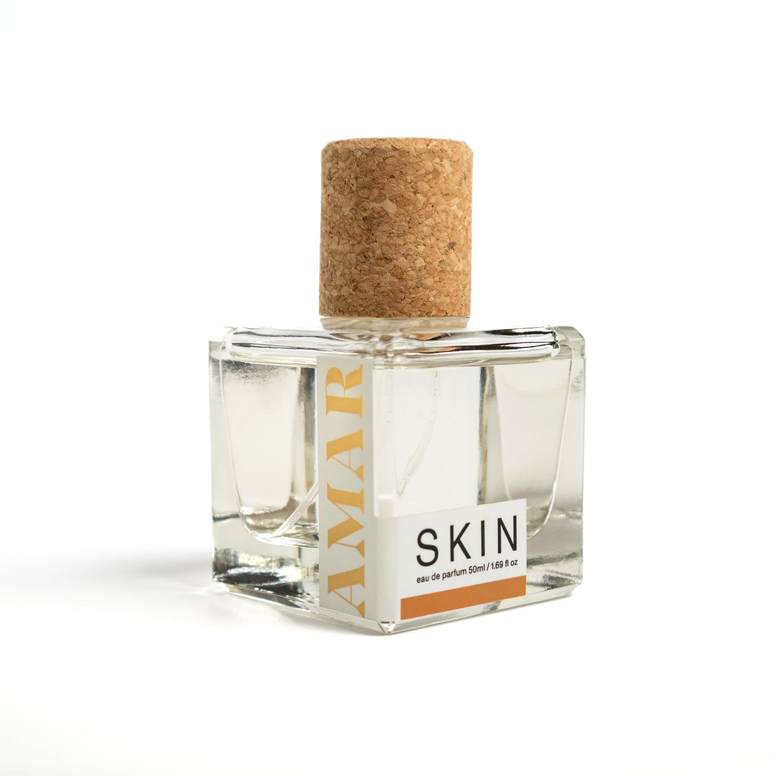 SKIN Eau de Parfum by AMAR, an indie perfume in a  clear glass bottle with cork top