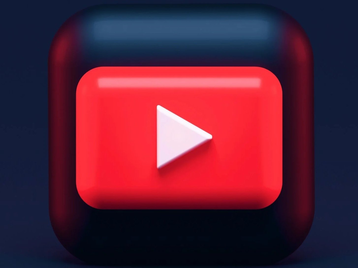 Close-up of a YouTube play button icon on a digital screen.