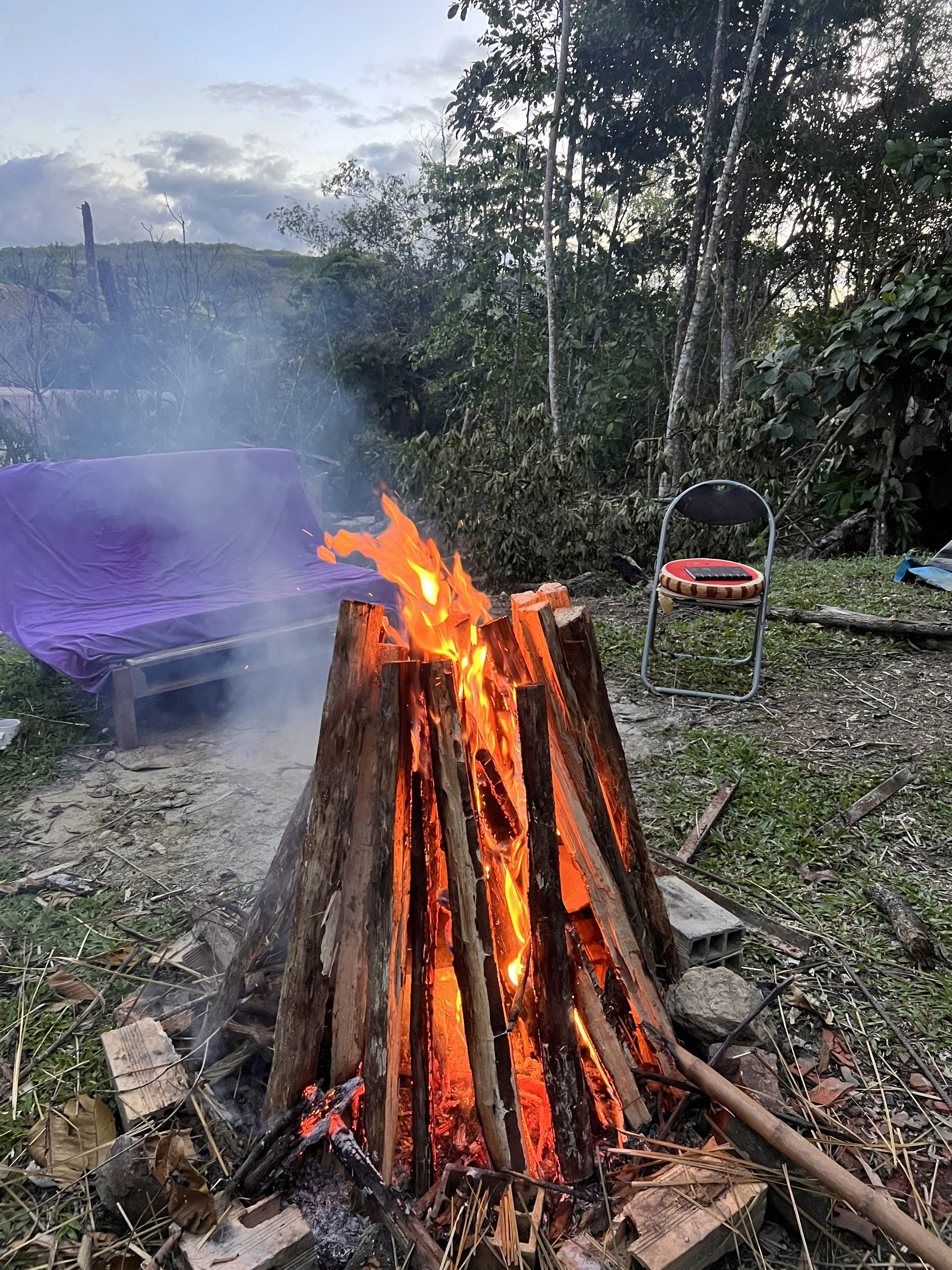 A bonfire blazes with clay pieces inside