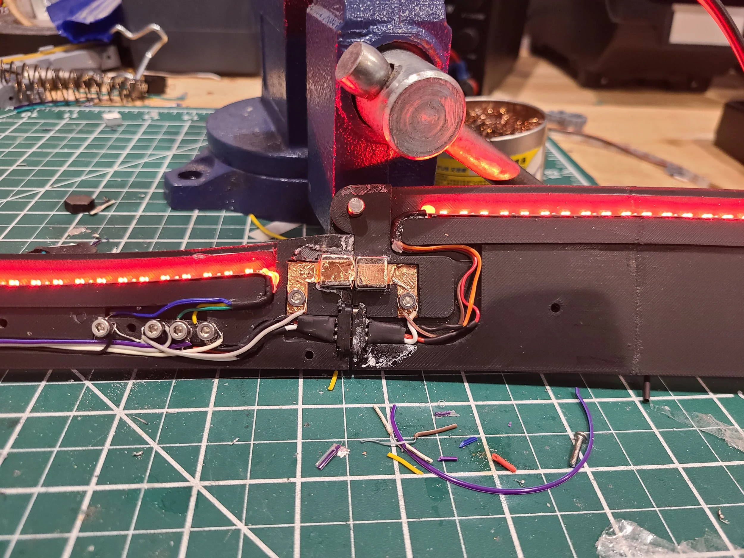 The Predator Badlands Sword features magnetic contacts that function as a switch to trigger the radiating LED animations.