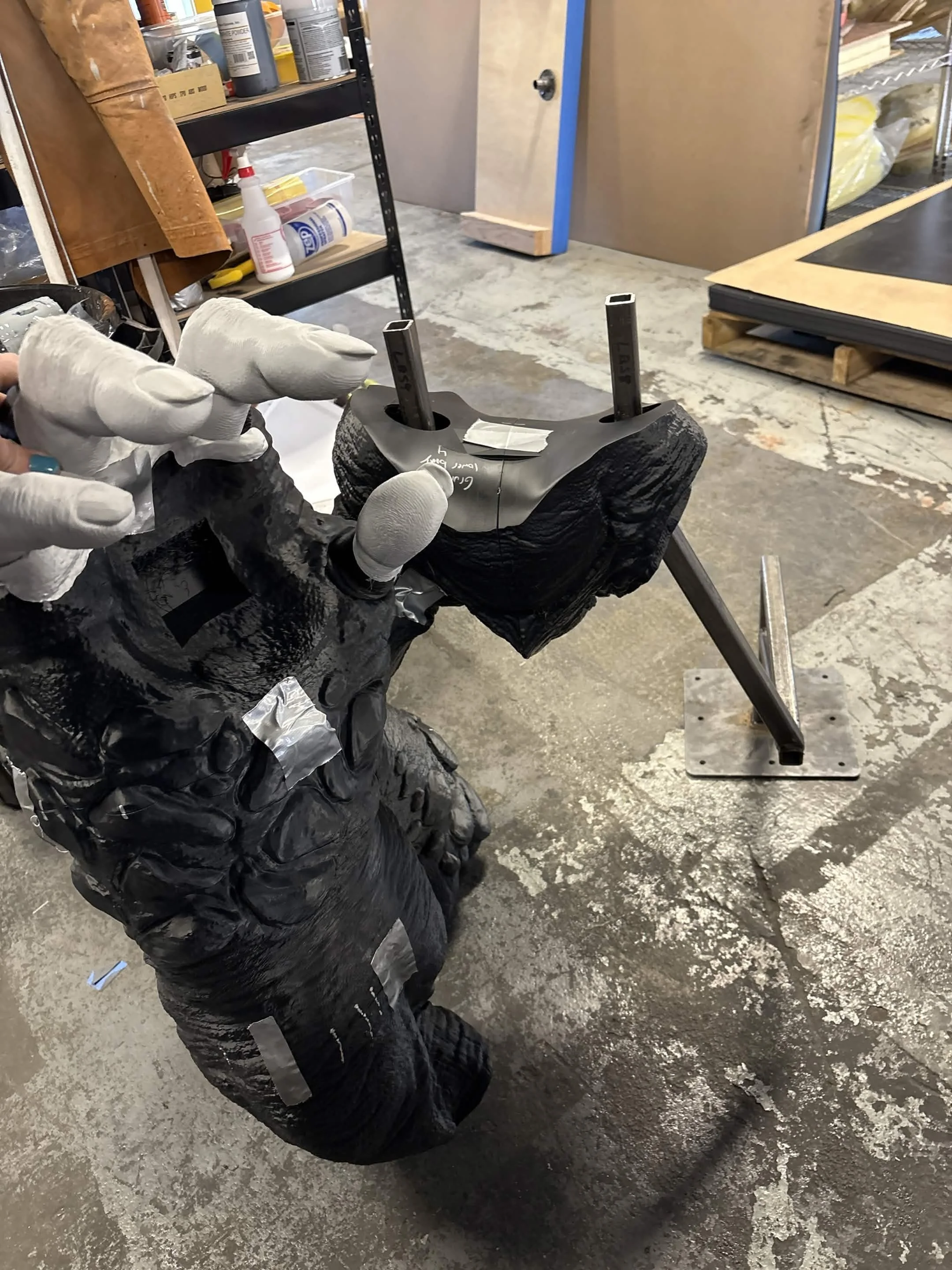 In-progress view of a life-size Grunt display piece, showing 3D-printed armor and exterior components being fitted directly around the completed structural core frame. (Credit: Ethan Wayne)