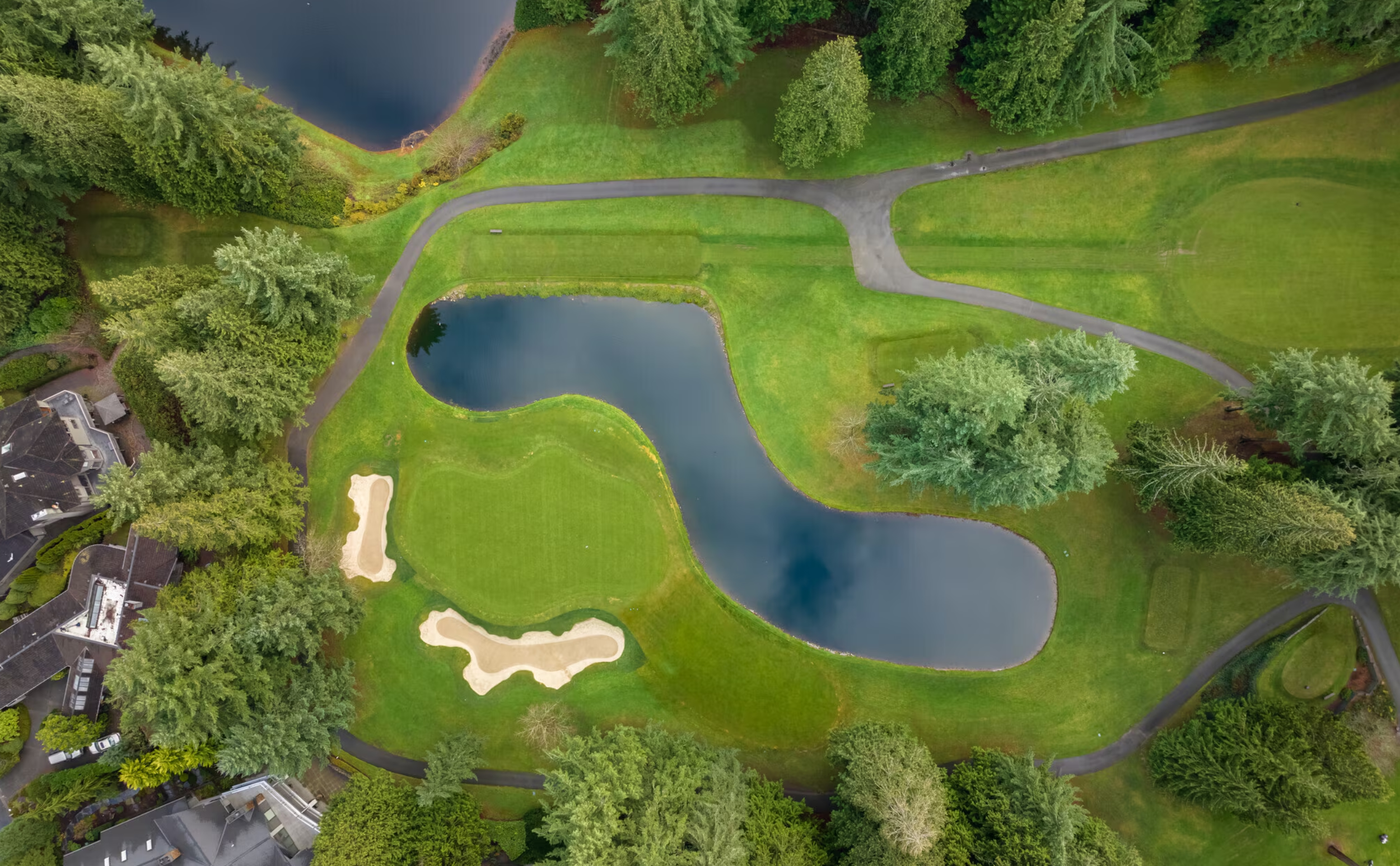 Aerial view of a golf course surrounded by natural landscapes in Sammamish, Washington.