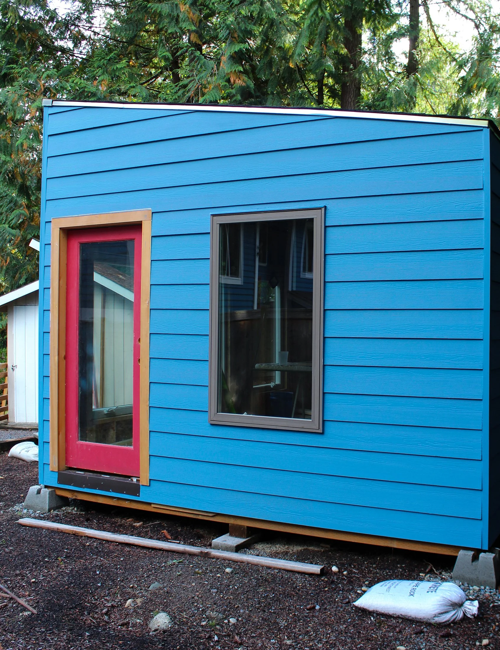 Custom detached accessory dwelling unit (DADU) exterior featuring modern siding, windows, and entry door installed by F&M Construction & Remodeling in Bellevue, WA, serving Bellevue, Seattle and Eastside homeowners.