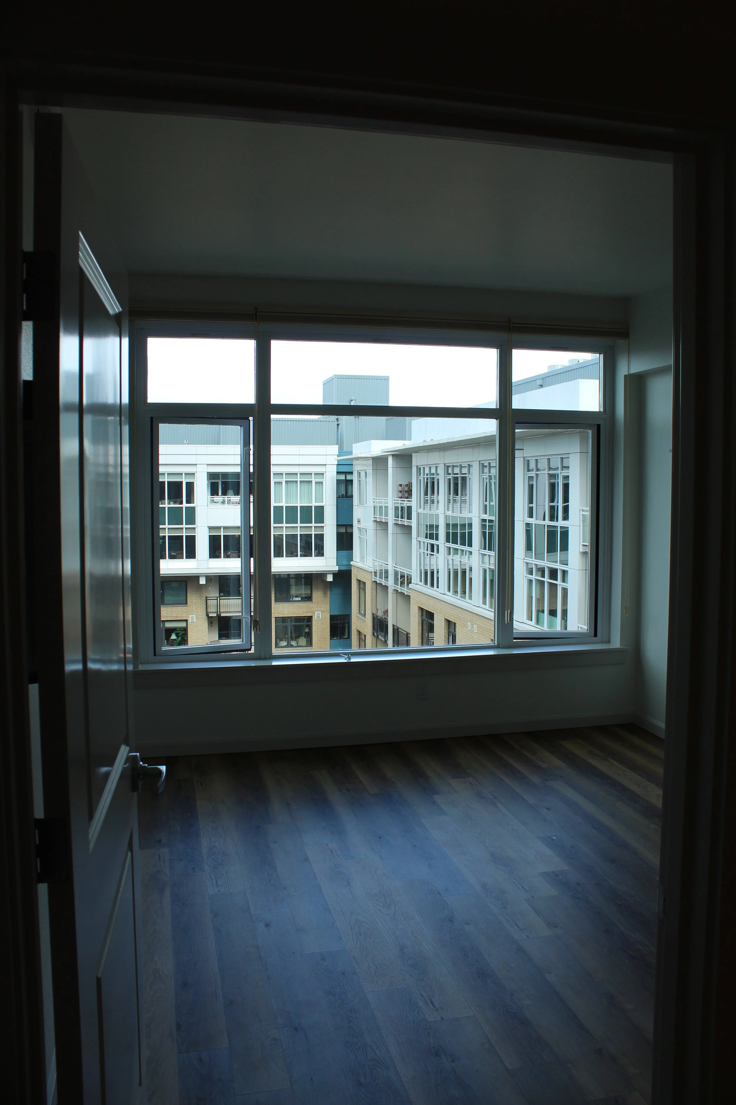 Custom window replacement completed by F&M Construction & Remodeling in Seattle, WA, featuring large modern windows that improve natural light, energy efficiency, and luxury residential living spaces.