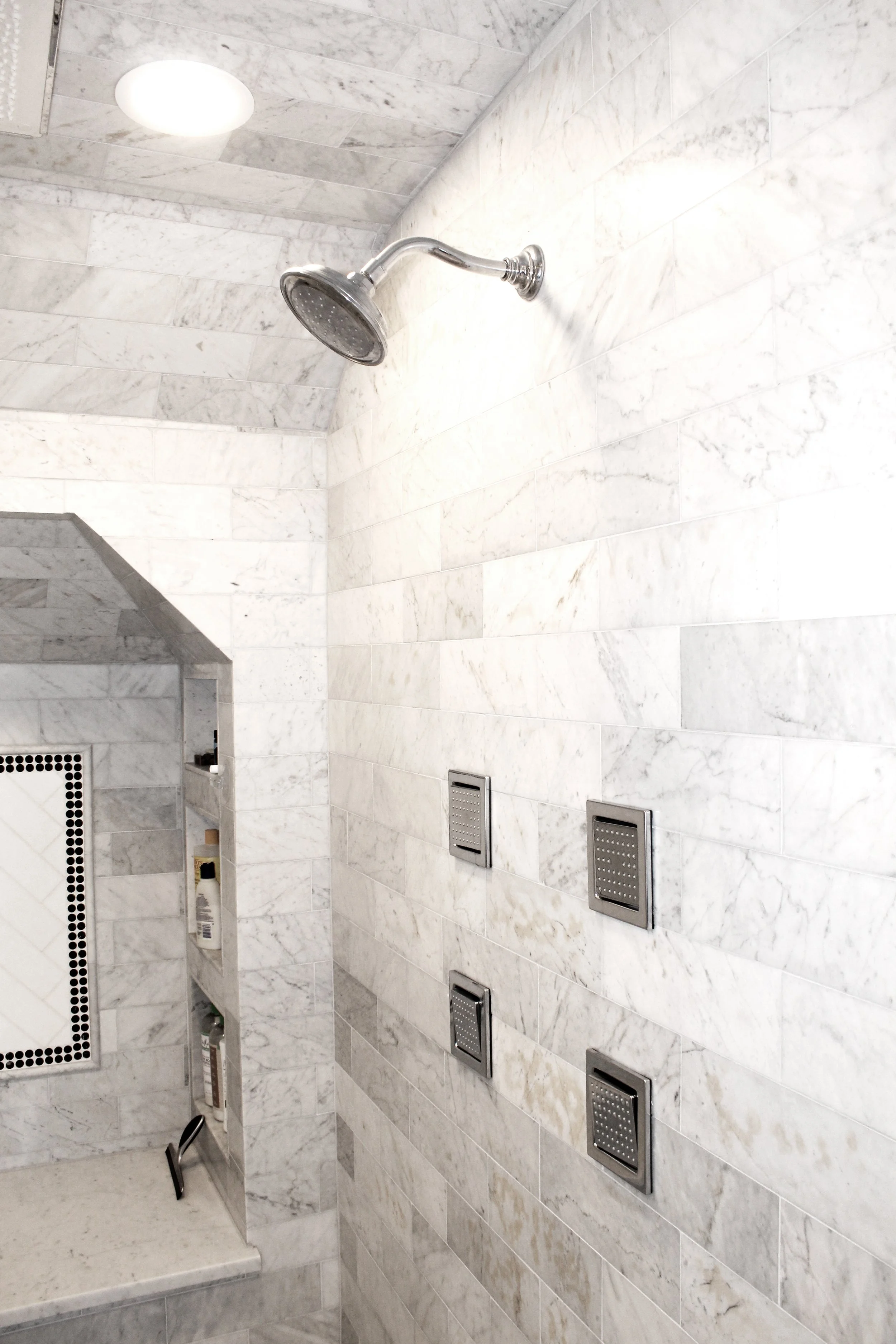 Marble shower wall tile installation completed by F&M Construction & Remodeling on Mercer Island, WA, featuring custom shower tile, premium bathroom finishes, and luxury bathroom remodeling for Bellevue, Seattle, and the Eastside.