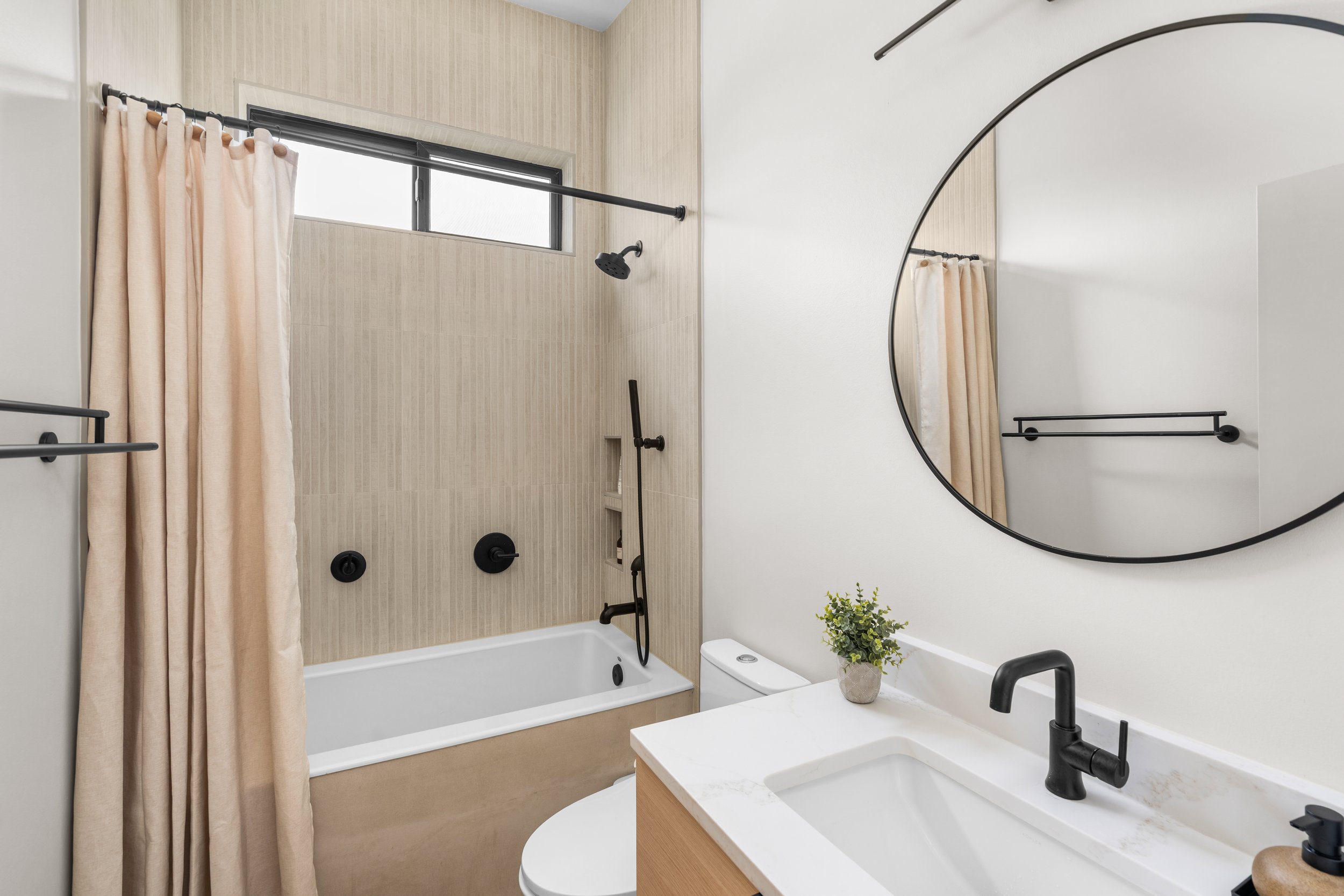 Bathroom remodel featuring new bathtub and shower installation by F&M Construction & Remodeling, serving Bellevue, Seattle, and the Eastside.