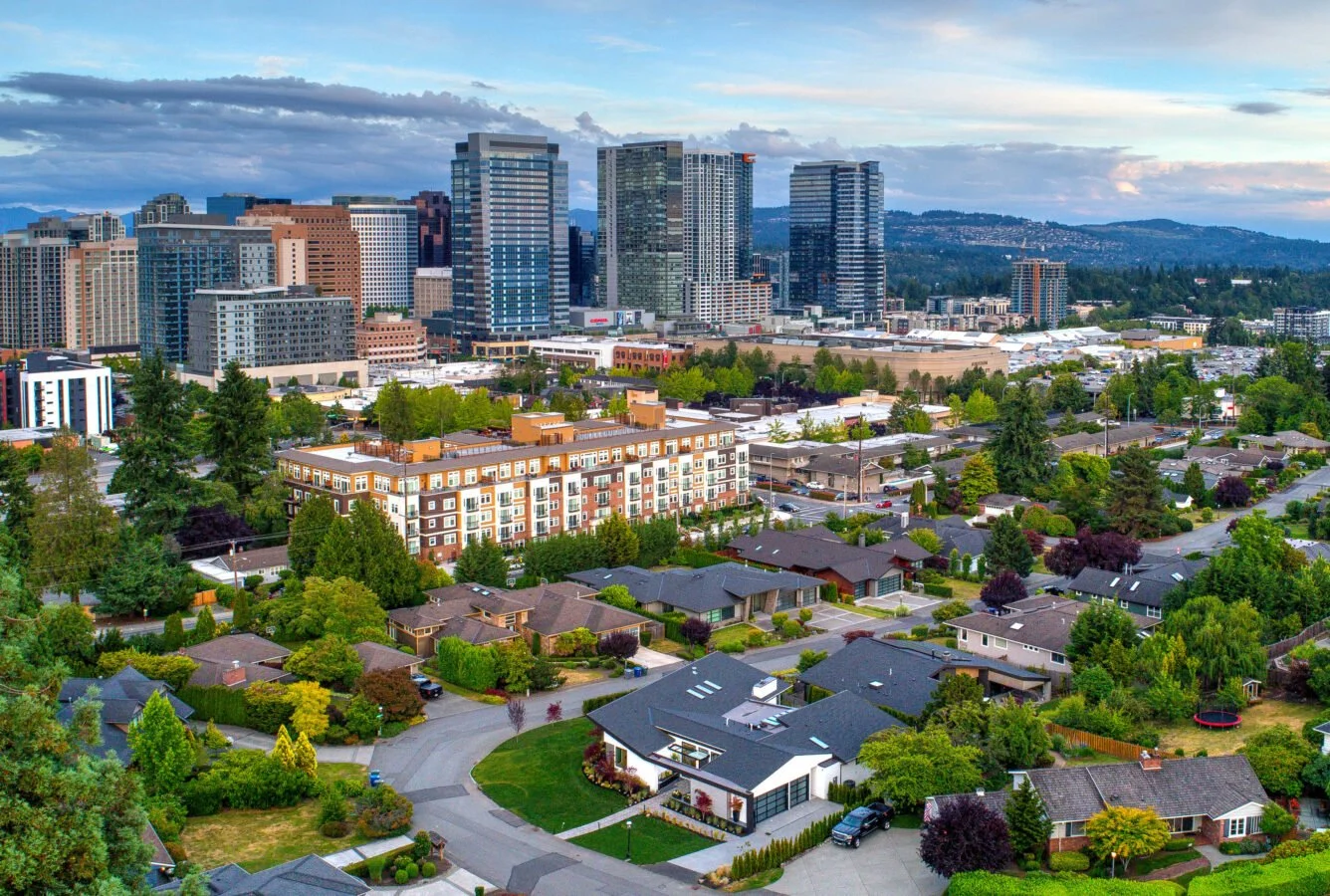 Aerial view of downtown Bellevue, WA, showcasing luxury neighborhoods and the city's vibrant skyline.