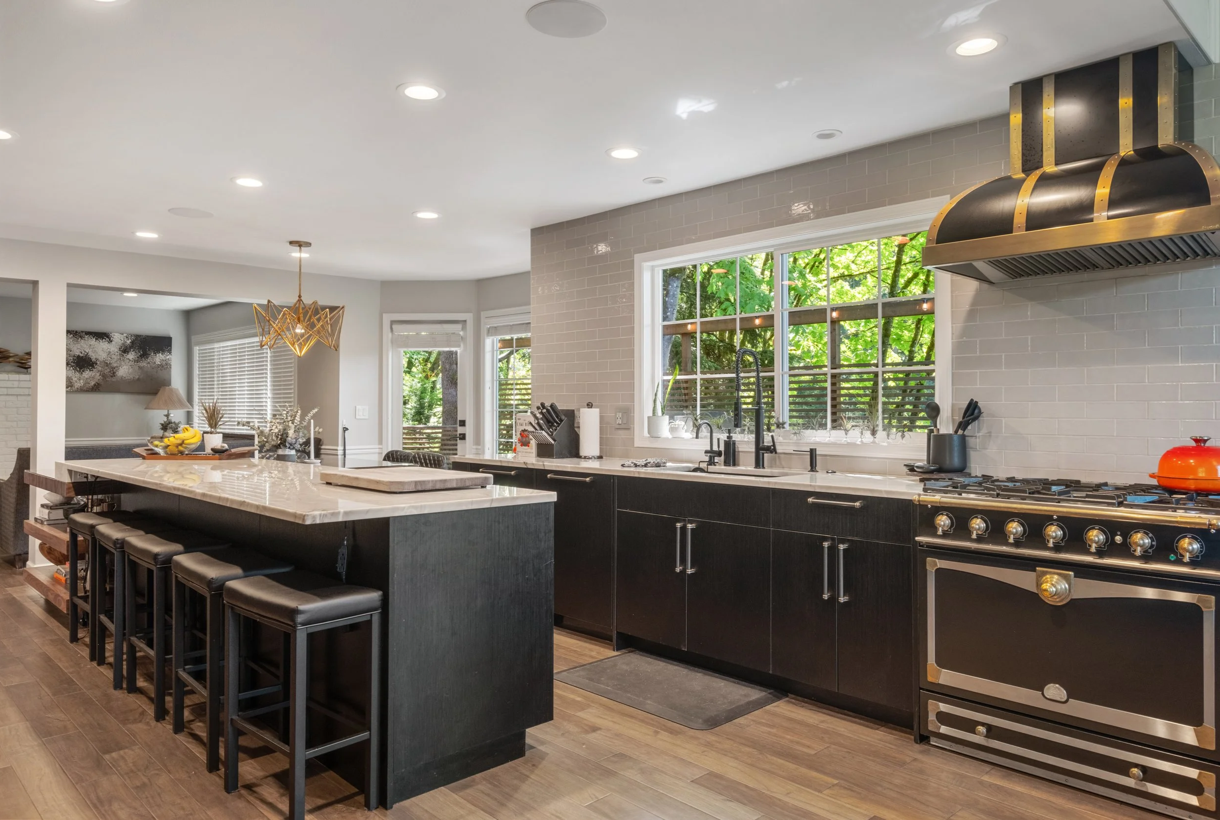 Luxury kitchen remodeling completed by F&M Construction & Remodeling in Kirkland, WA, featuring custom cabinetry, a large kitchen island, premium countertops, and high-end finishes for homeowners throughout Bellevue, Seattle, and the Eastside.