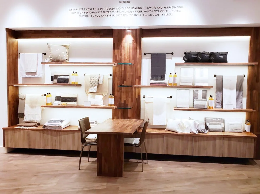 Custom retail display installation completed by F&M Construction & Remodeling at Duxiana in Bellevue, WA, featuring architectural millwork, built-in merchandising displays, and premium commercial renovations serving Seattle and the Eastside.